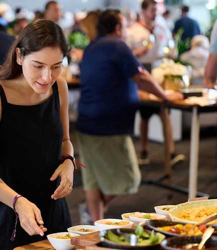 Guest selecting food in the UEFA EURO 2028™ Official Hospitality area